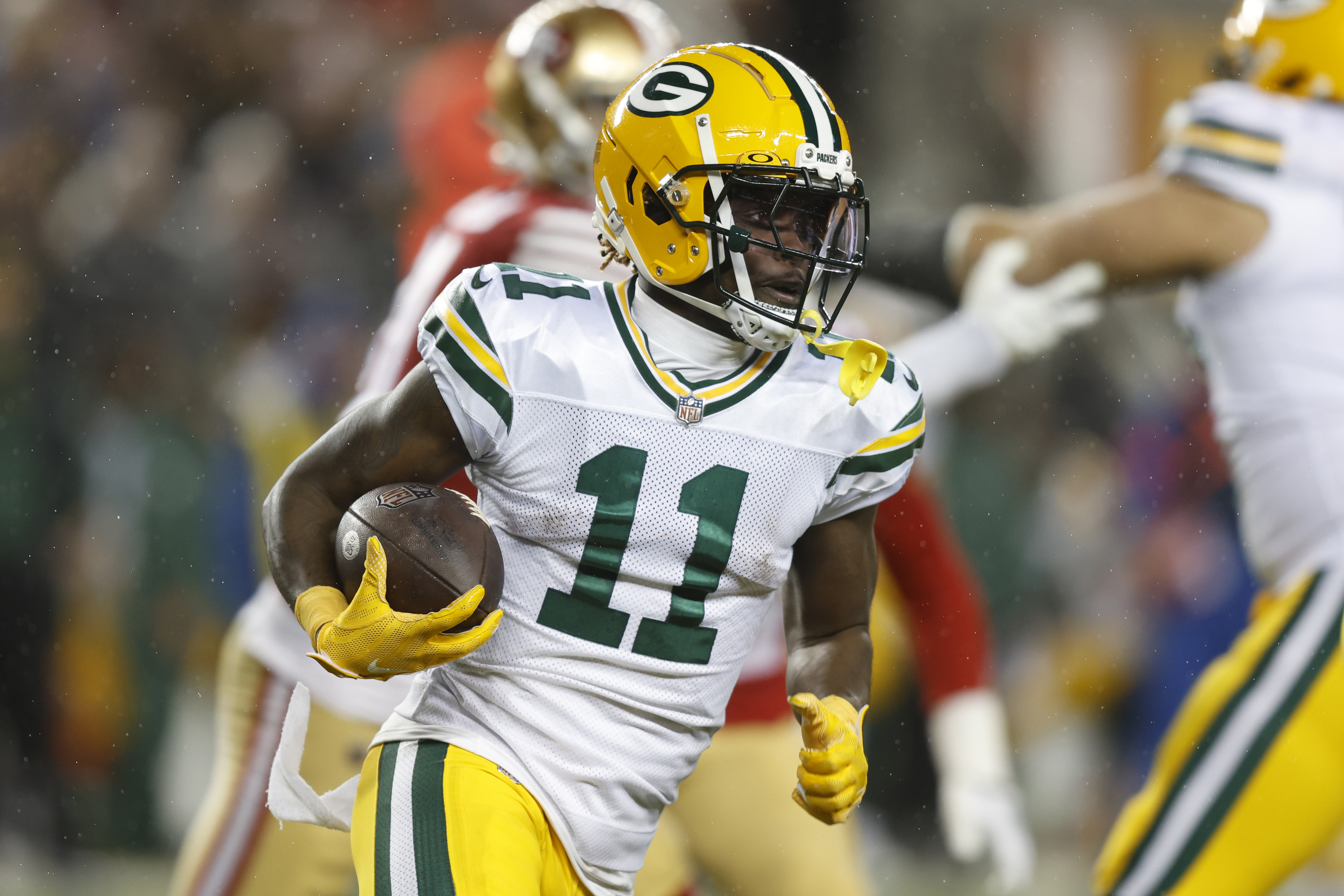 Jayden Reed of the Green Bay Packers runs with the ball during the second half against the San Francisco 49ers in the NFC Divisional Playoffs at Levi’s Stadium on January 20, 2024 in Santa Clara, California.